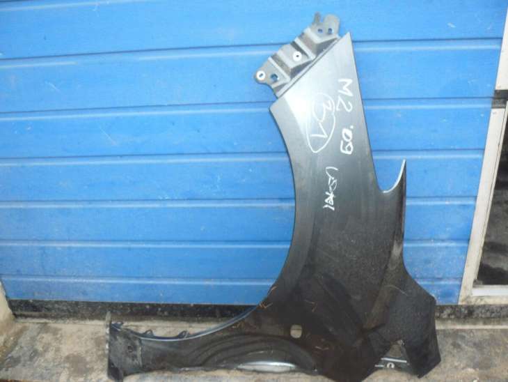 Mazda 2 2009r Błotnik Przedni Lewy