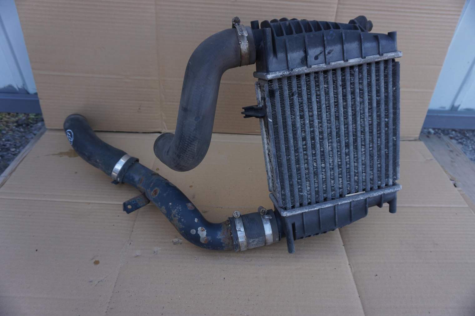 NISSAN NOTE E11 CHŁODNICA INTERCOOLER 144619U21A